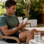 Runner reviewing magnesium supplement at kitchen table