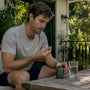 Runner about to take magnesium supplement at home
