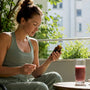 Runner choosing magnesium supplement at kitchen table
