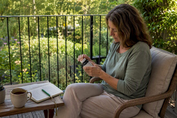 Woman preparing magnesium supplement at home