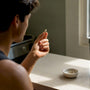 Runner holding magnesium supplement capsule