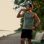 Runner drinking after an outdoor run