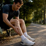 Runner checking a twitching calf after exercise