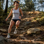 Runner descending a steep trail