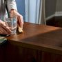 Separated mineral supplements beside morning water