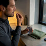 Runner taking an anonymous capsule with water