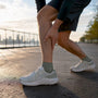 Runner checking lower shin after a run