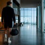 Runner walking through airport after travel