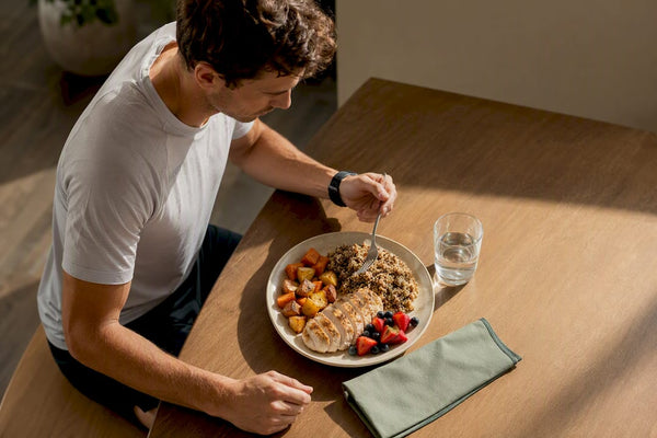 Runner serving a balanced post-run recovery meal