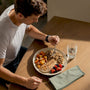 Runner serving a balanced post-run recovery meal
