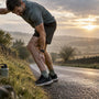 Runner holding cramped calf after run