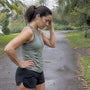 Runner pausing with exercise headache outdoors