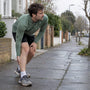 Runner pausing with a painful calf cramp